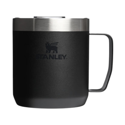 Black Stanley mug with a silver rim on a white background