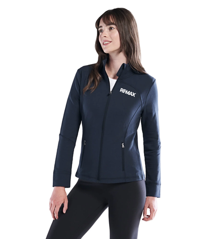 Woman wearing a navy blue jacket with Remax logo on a white background