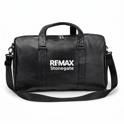 Black leather duffle bag with straps and a REMAX Stonegate logo