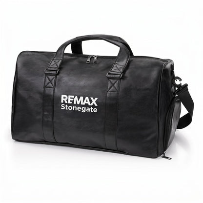 Black leather duffle bag with straps and a REMAX Stonegate logo