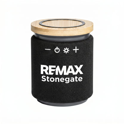 Bluetooth speaker with a wooden charger head on top