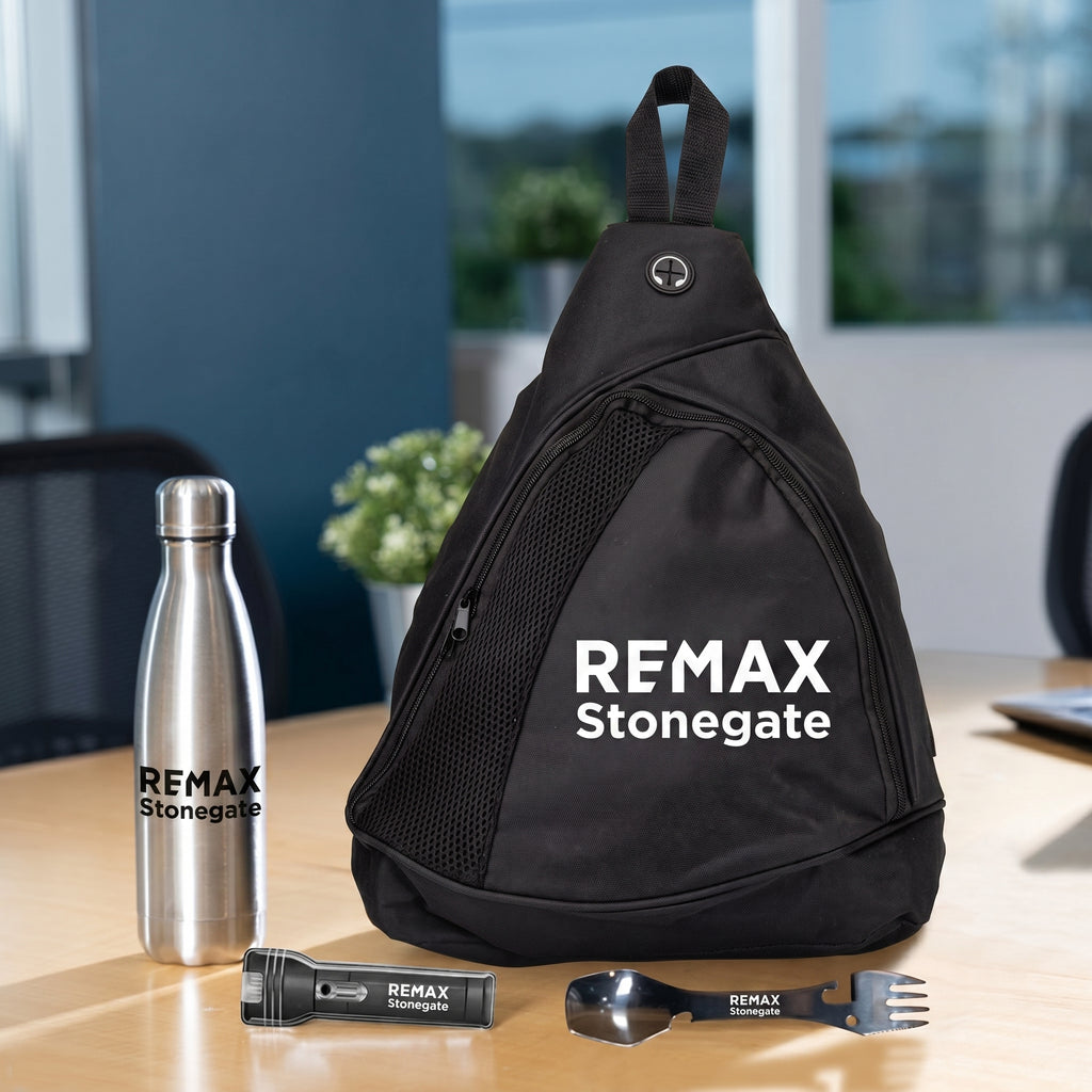 Black sling bag, silver water bottle, and black tool set with REMAX Stonegate branding on a wooden surface.
