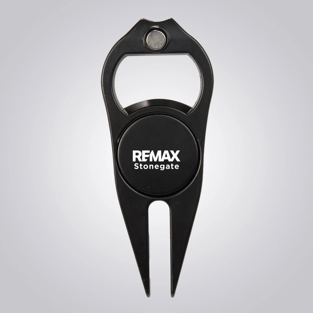 Black golf divot tool with bottle opener and 'REMAX Stonegate' logo on a gray background