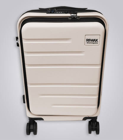 Beige suitcase with black accents on a light gray background