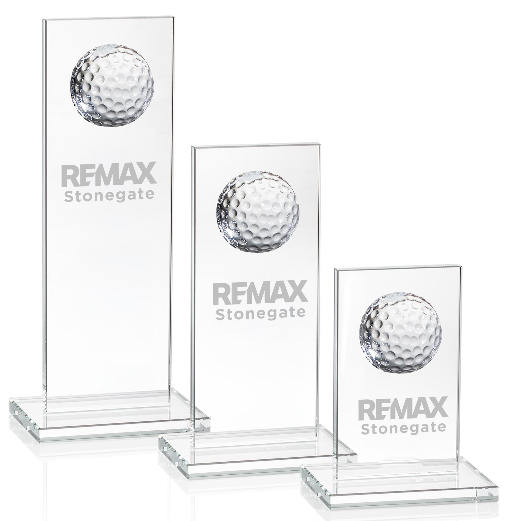 Three glass displays with golf ball designs and 'REMAX Stonegate' branding on a white background.