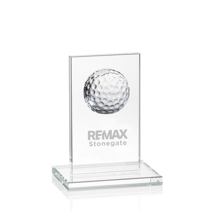 Glass award with golf ball and engraved text on a white background