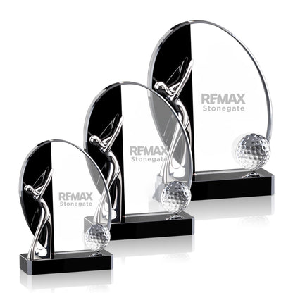 Set of crystal golf trophies with REMAX branding on a white background