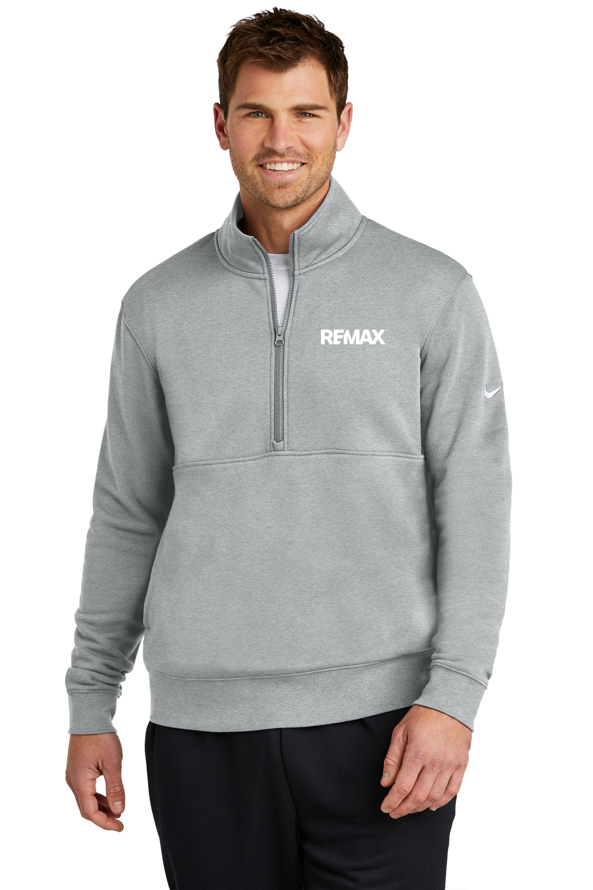 A man wearing a heather gray Nike quarter-zip pullover with a white REMAX logo on the chest and a white Nike swoosh on the sleeve, set against a plain white background.