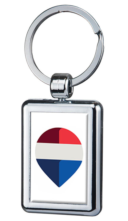 Keychain with a heart-shaped design featuring red, white, and blue colors on a white background.