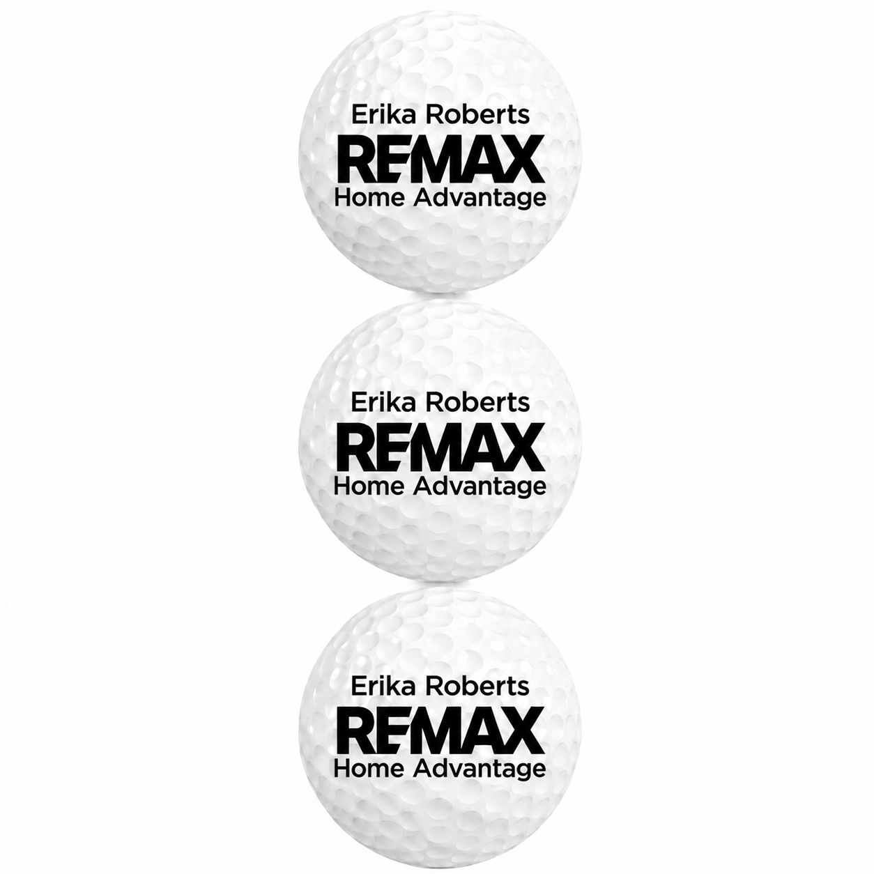 Three golf balls with Erika Roberts REMAX Home Advantage branding on a white background