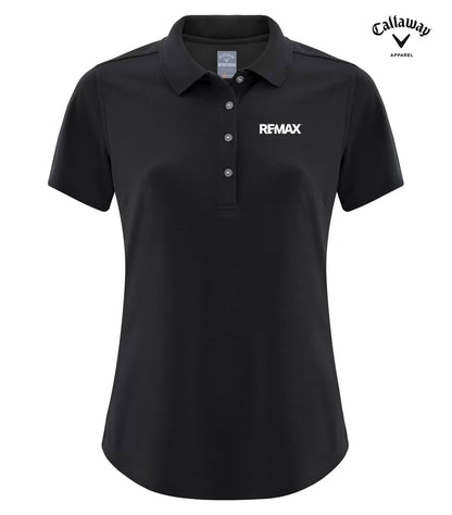 A black short-sleeve polo shirt with a three-button placket and a white REMAX logo on the left chest, shown on a plain white background with a Callaway Approved logo in the top right corner.