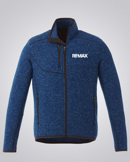 A blue heathered zip-up fleece jacket with a high collar, black trim, and a white REMAX logo on the left chest, displayed on a neutral gray background.