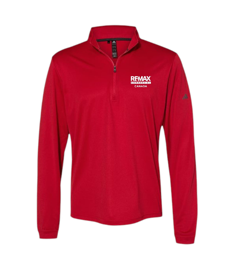 A red long-sleeve quarter-zip pullover jacket with a white 'REMAX BREAKING TUMORS CANADA' logo printed on the left chest, shown against a plain white background.