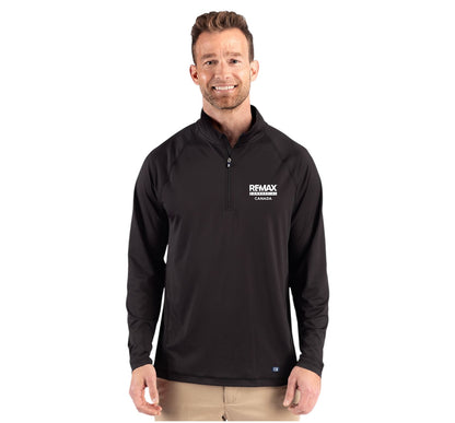 A man wearing a black long-sleeve quarter-zip pullover with a white 'REMAX' logo on the left chest, paired with khaki pants, against a plain white background.