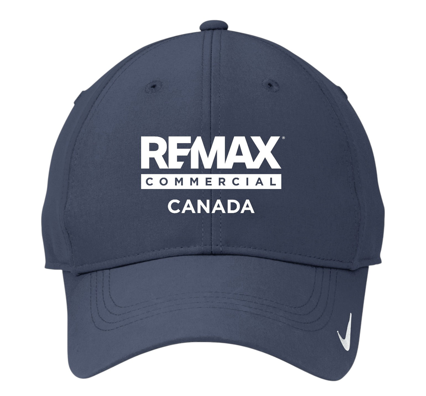 A navy blue baseball cap featuring a white embroidered 'REMAX COMMERCIAL CANADA' logo on the front and a small white Nike swoosh on the side, set against a plain white background.