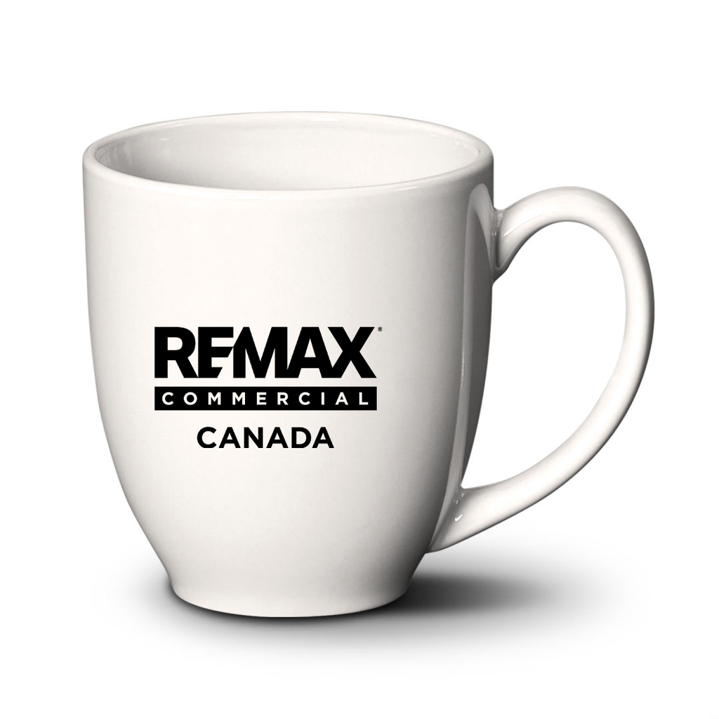 A white ceramic coffee mug with the black printed text 'REMAX COMMERCIAL CANADA' on the front, shown on a white background with a soft shadow.