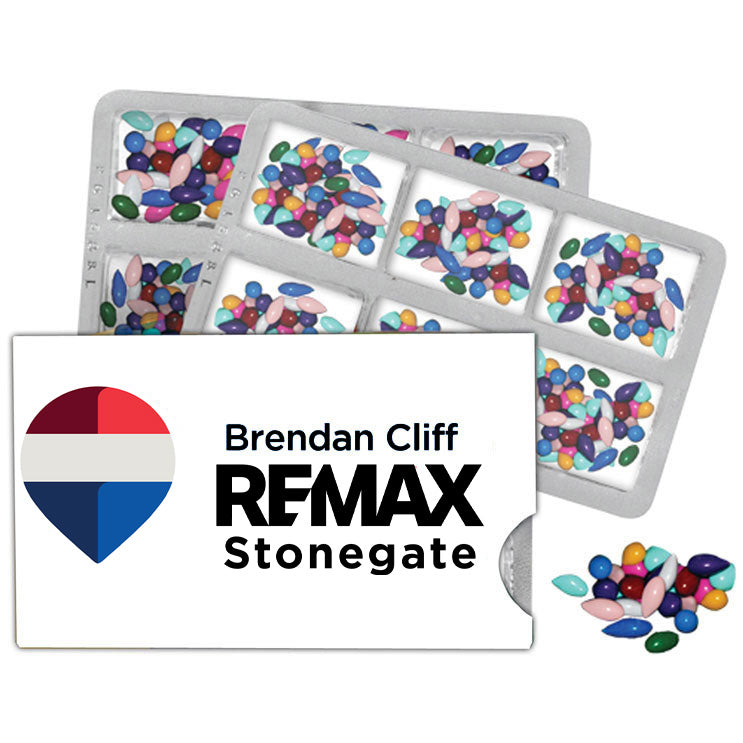 Colorful jelly beans in a transparent container with a branded card featuring 'Brendan Cliff REMAX Stonegate' logo.